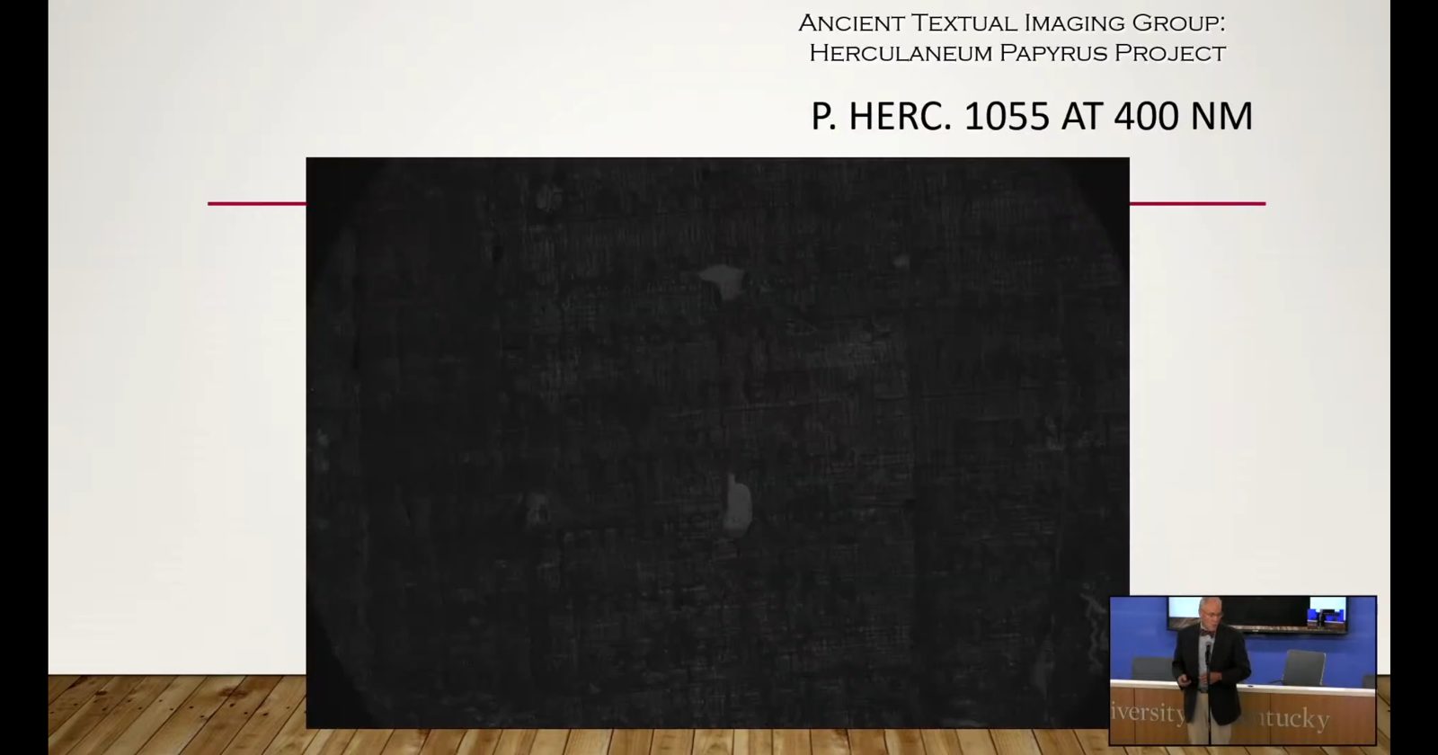 Slide: P. Herc. 1055 at 400 nm. The fragment is a flat black rectangle